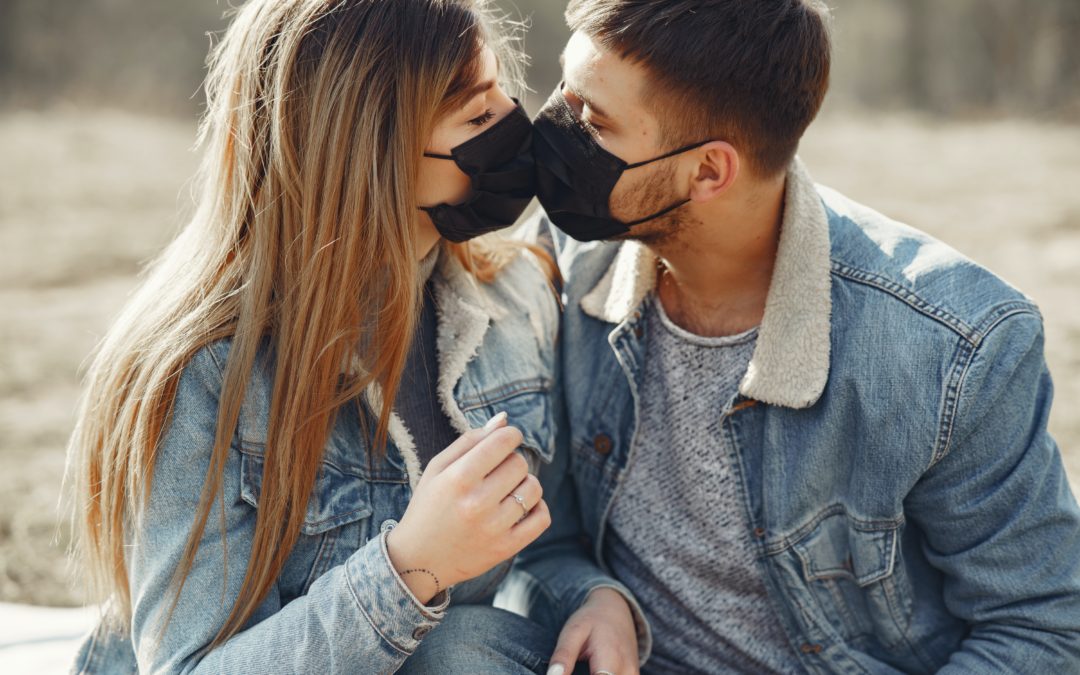 Dating During the Coronavirus: Couple Kissing With Medical Masks On
